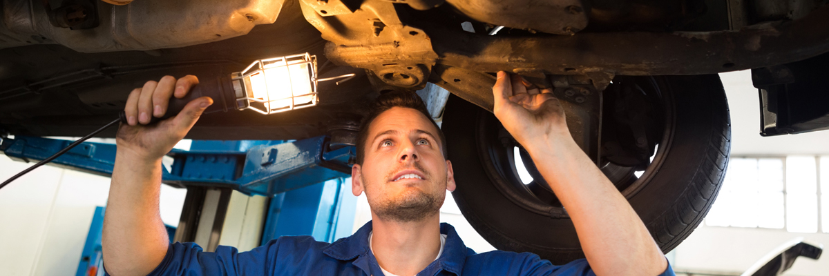 Mechanic doing an mot test on a vehicle - MOT Durham